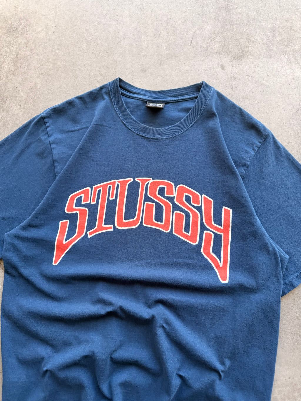 Stussy navy arch spellout - M